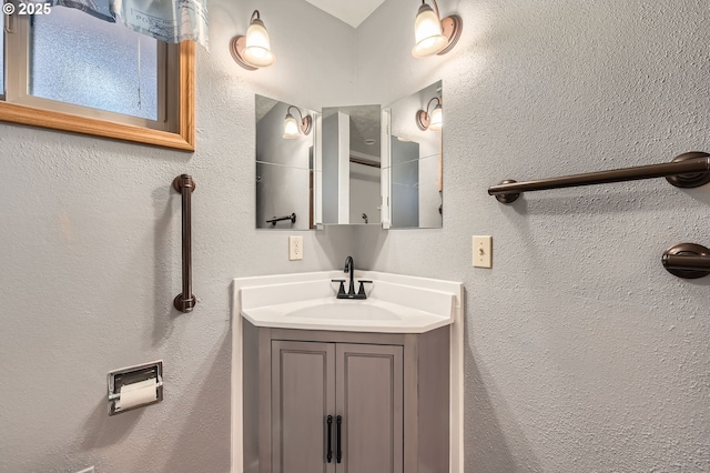 863 NE Fleming Ave Unit B-10, Gresham, OR 97030 - bathroom with vanity and a textured wall