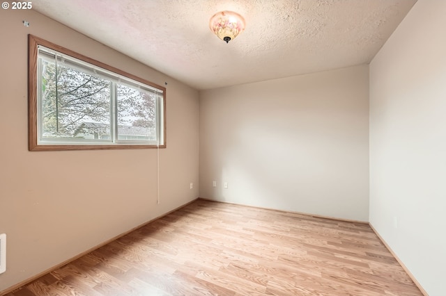 863 NE Fleming Ave Unit B-10, Gresham, OR 97030 - spare room with light wood finished floors and a textured ceiling