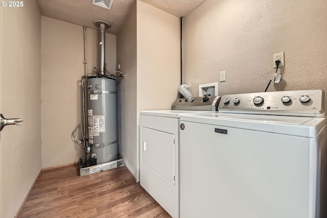 863 NE Fleming Ave Unit B-10, Gresham, OR 97030 - washroom featuring strapped water heater, separate washer and dryer, and light wood finished floors