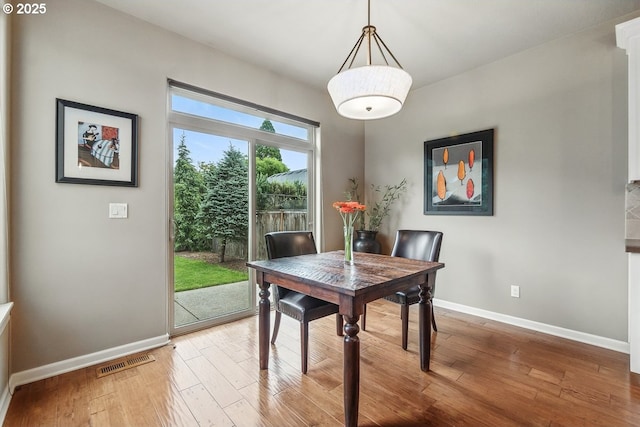 418 SW 140th Ave, Beaverton, OR 97006 - dining room featuring baseboards and hardwood / wood-style floors