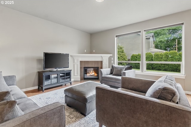 418 SW 140th Ave, Beaverton, OR 97006 - living room with light wood-style flooring and a tiled fireplace