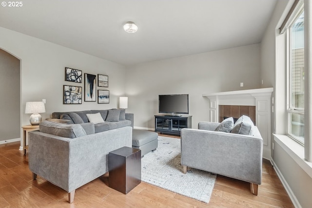 418 SW 140th Ave, Beaverton, OR 97006 - living area featuring light wood-type flooring and arched walkways