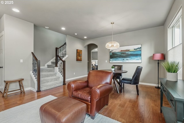 418 SW 140th Ave, Beaverton, OR 97006 - living room featuring arched walkways, wood finished floors, recessed lighting, and stairway