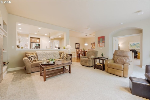 14931 SW 88th Ave, Tigard, OR 97224 - living room with recessed lighting, arched walkways, light colored carpet, and baseboards