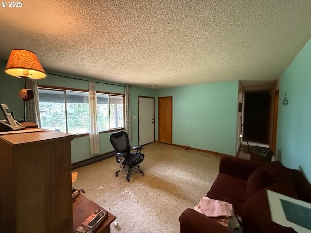 living area featuring a baseboard radiator, baseboards, and a textured ceiling