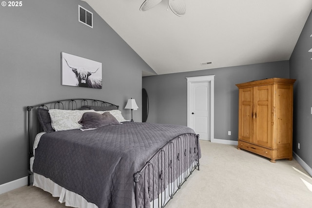 bedroom with light carpet, vaulted ceiling, and ceiling fan