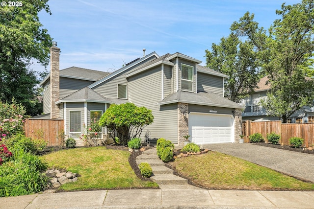 12909 SW Jacob Ct, Portland, OR 97224 - view of front of house featuring driveway, a garage, a chimney, and roof with shingles