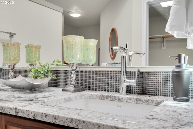 12909 SW Jacob Ct, Portland, OR 97224 - bathroom view of tasteful backsplash and vanity