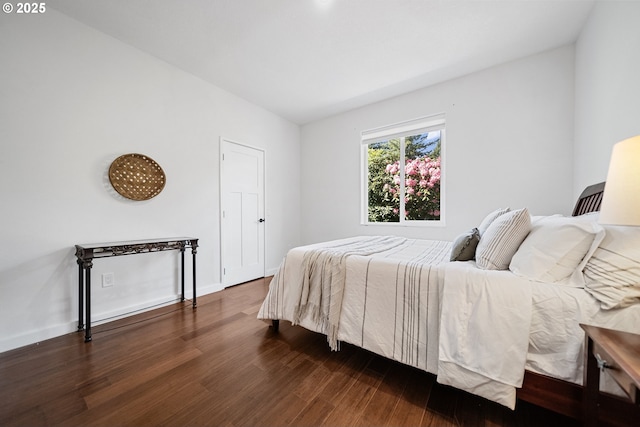 bedroom featuring dark wood-style flooring