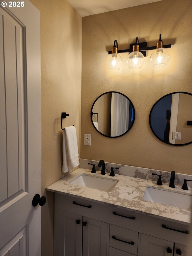 full bath with double vanity and a sink