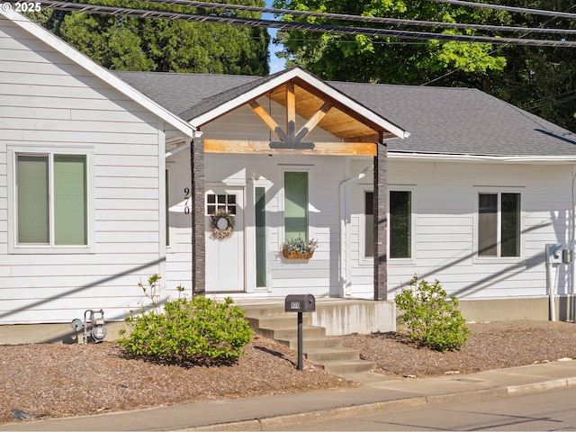 view of front of property featuring roof with shingles