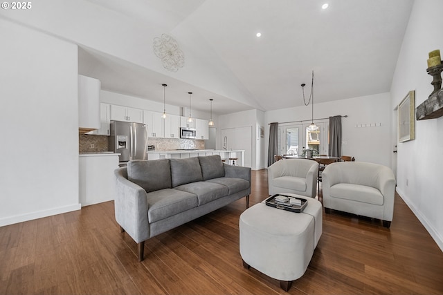 living room with baseboards, recessed lighting, dark wood finished floors, and high vaulted ceiling