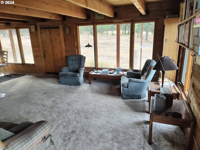 60327 Lower Divide Rd, Joseph, OR 97846 - living area featuring wooden walls, beam ceiling, and concrete flooring