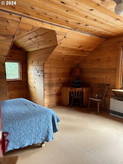60327 Lower Divide Rd, Joseph, OR 97846 - bedroom featuring vaulted ceiling, wood walls, wooden ceiling, and heating unit