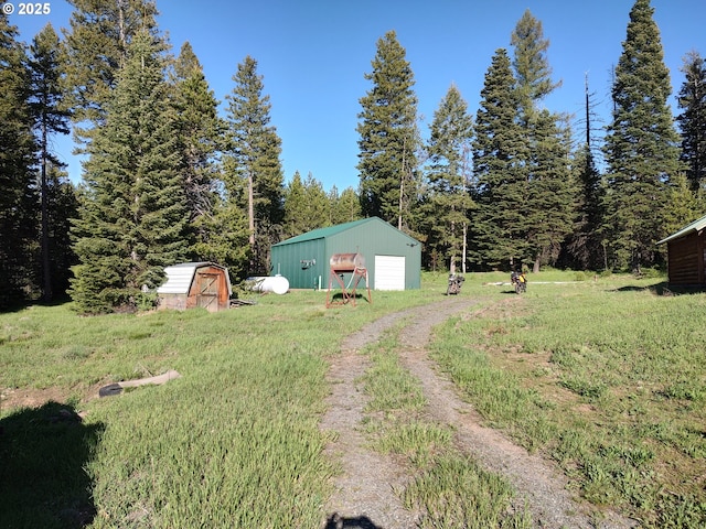 60327 Lower Divide Rd, Joseph, OR 97846 - view of green lawn with a garage and driveway