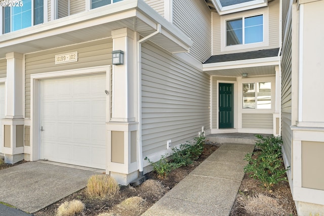 doorway to property featuring a garage