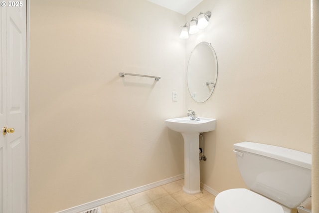 bathroom featuring tile patterned floors and toilet