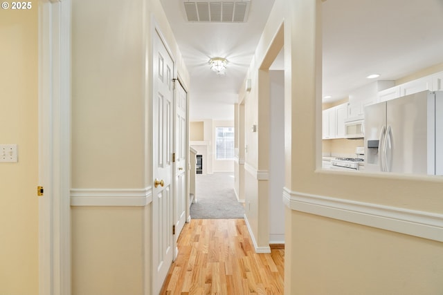 hallway featuring light wood-type flooring