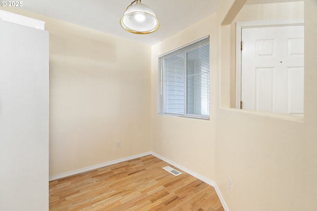 spare room featuring light hardwood / wood-style floors