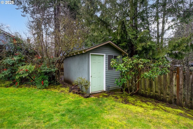 view of shed with fence