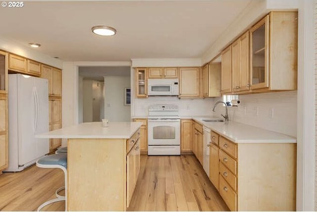 2040 Spruce Ave, Woodland, WA 98674 - kitchen with white appliances, light wood-style floors, a kitchen island, a sink, and light brown cabinets