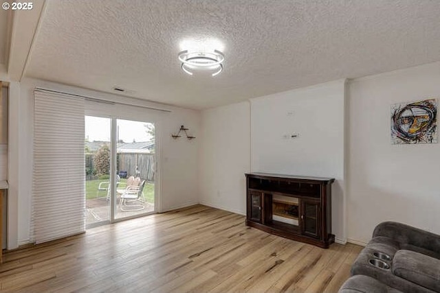 2040 Spruce Ave, Woodland, WA 98674 - living room featuring a textured ceiling and light wood finished floors
