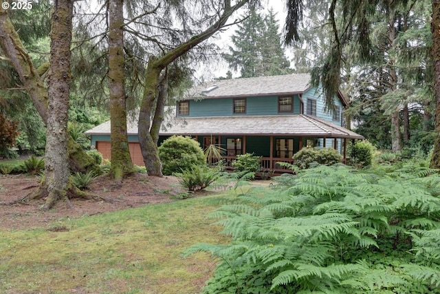 1630 SW 14th St, Warrenton, OR 97146 - country-style home with covered porch and an attached garage