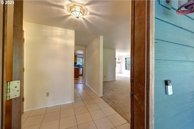 1630 SW 14th St, Warrenton, OR 97146 - hall with light tile patterned floors and a textured ceiling
