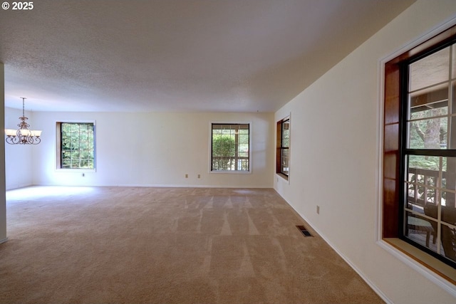 1630 SW 14th St, Warrenton, OR 97146 - empty room featuring a chandelier and carpet