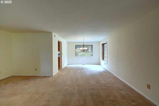 1630 SW 14th St, Warrenton, OR 97146 - empty room featuring a chandelier and light carpet