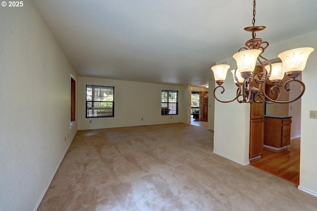 1630 SW 14th St, Warrenton, OR 97146 - empty room featuring a chandelier and light carpet