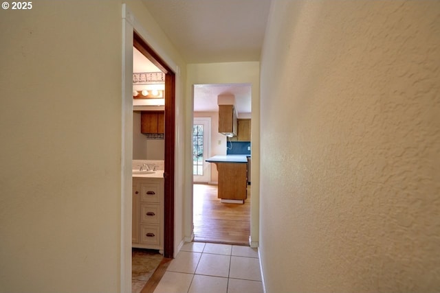1630 SW 14th St, Warrenton, OR 97146 - hall featuring light tile patterned flooring and a textured wall