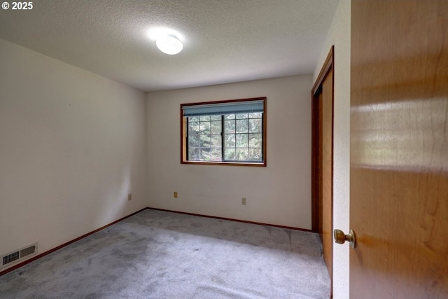 1630 SW 14th St, Warrenton, OR 97146 - unfurnished bedroom featuring carpet flooring and a textured ceiling