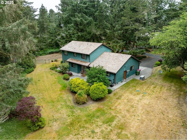 1630 SW 14th St, Warrenton, OR 97146 - aerial view of property and surrounding area featuring a heavily wooded area