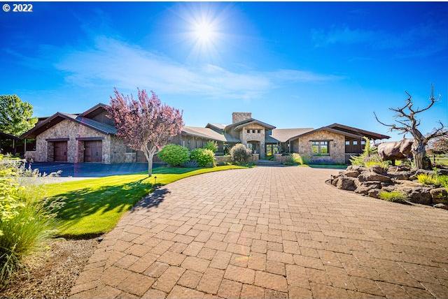 view of front facade with a front lawn and a garage