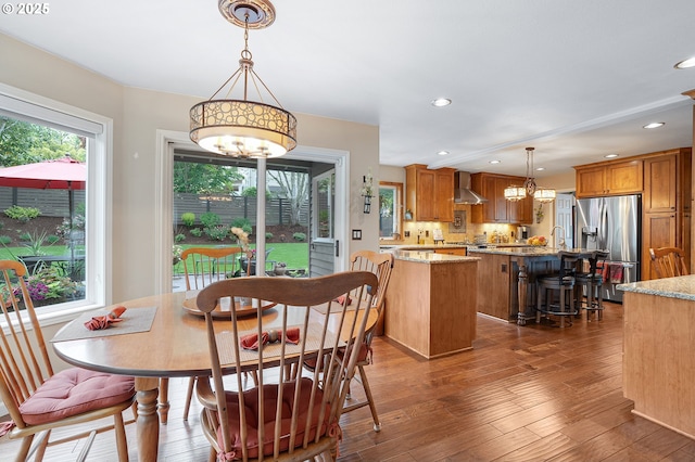 15137 SW Peachtree Dr, Portland, OR 97224 - dining area featuring a chandelier, plenty of natural light, dark wood-style floors, and recessed lighting