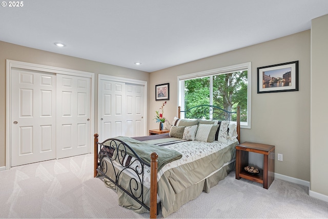 15137 SW Peachtree Dr, Portland, OR 97224 - bedroom featuring carpet flooring, two closets, and recessed lighting