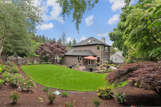 15137 SW Peachtree Dr, Portland, OR 97224 - rear view of property featuring a patio area, a chimney, and a fenced backyard