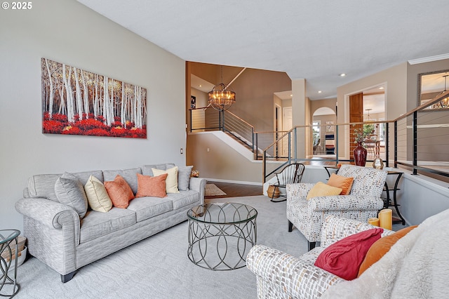 15137 SW Peachtree Dr, Portland, OR 97224 - carpeted living room with stairway, a chandelier, arched walkways, and recessed lighting