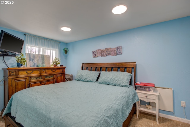 bedroom featuring carpet flooring and baseboards