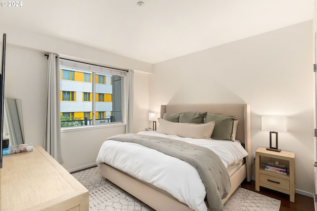 1125 NW 9th Ave Unit 419, Portland, OR 97209 - bedroom with baseboards and wood finished floors