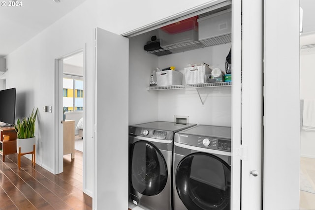 1125 NW 9th Ave Unit 419, Portland, OR 97209 - laundry area featuring washing machine and clothes dryer, dark wood finished floors, and baseboards