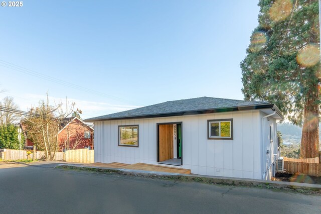 view of side of home featuring a garage