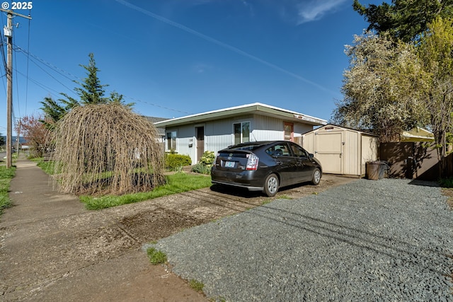 view of home's exterior featuring an outbuilding and a shed
