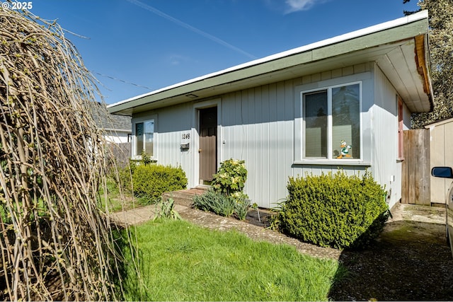 view of home's exterior with fence