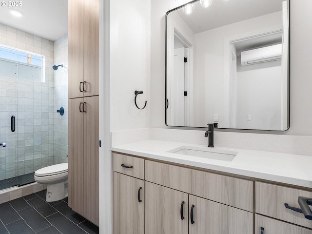 full bath featuring vanity, tile patterned flooring, toilet, a stall shower, and a wall mounted air conditioner