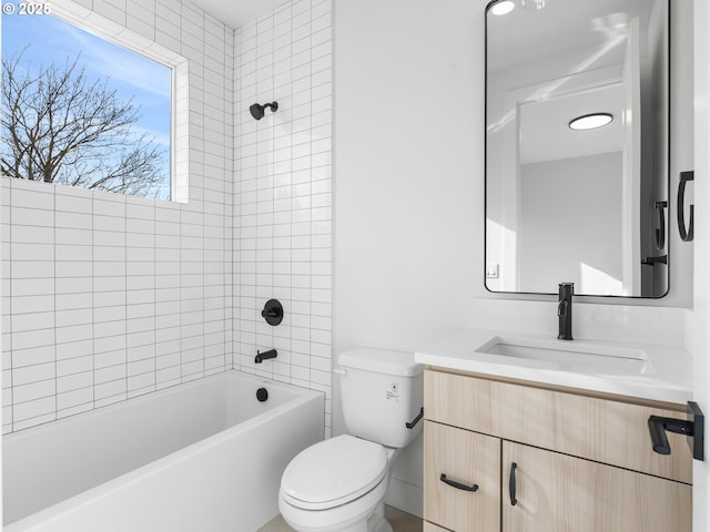 bathroom with toilet, vanity, and shower / washtub combination