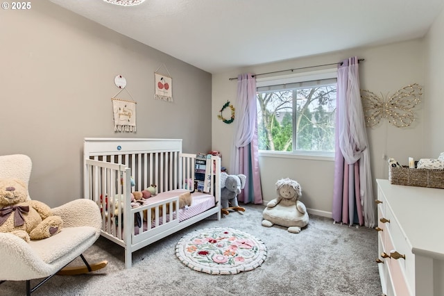 carpeted bedroom featuring baseboards