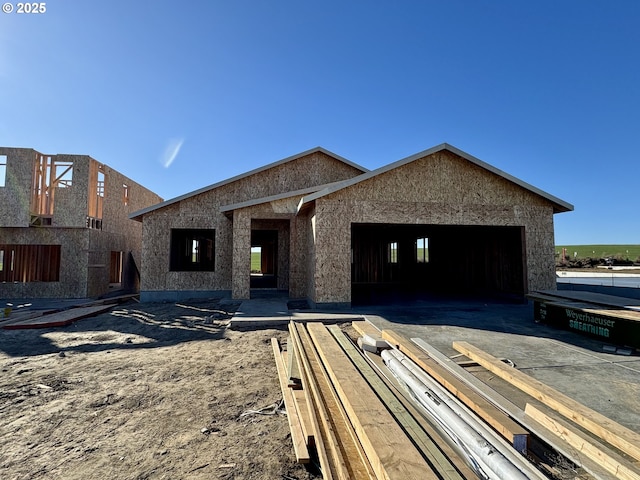 property under construction featuring an attached garage