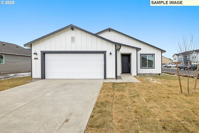 modern farmhouse style home with a front lawn, board and batten siding, concrete driveway, and an attached garage